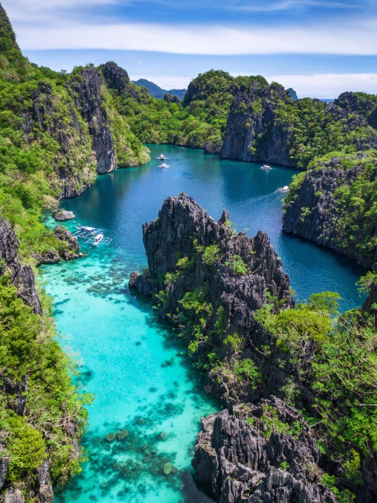 The limestone karst cliffs and turquoise lagoons of El Nido, Palawan, in the Philippines