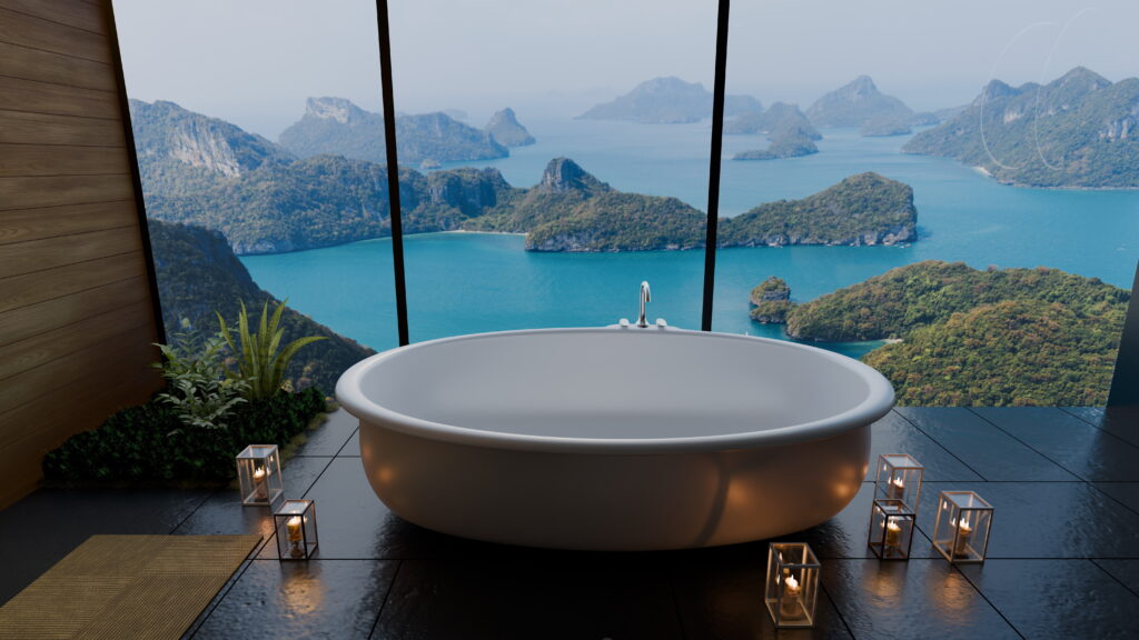 A freestanding oval bathtub in a luxury hotel bathroom with floor-to-ceiling windows overlooking turquoise water and karst islands